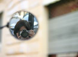 self portrait in rear view mirror