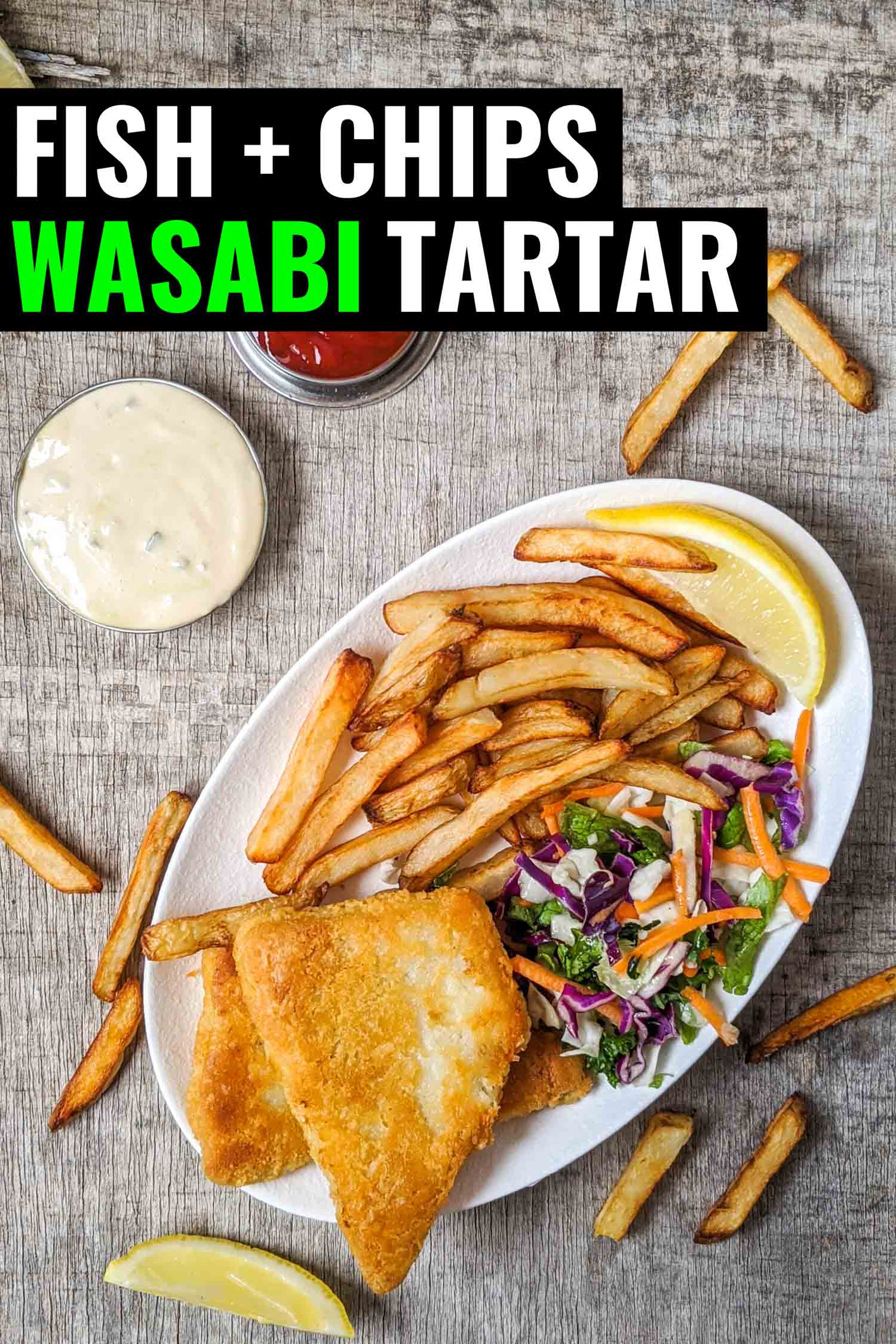 Fish and chips on a white plate with ketchup and tartar sauce
