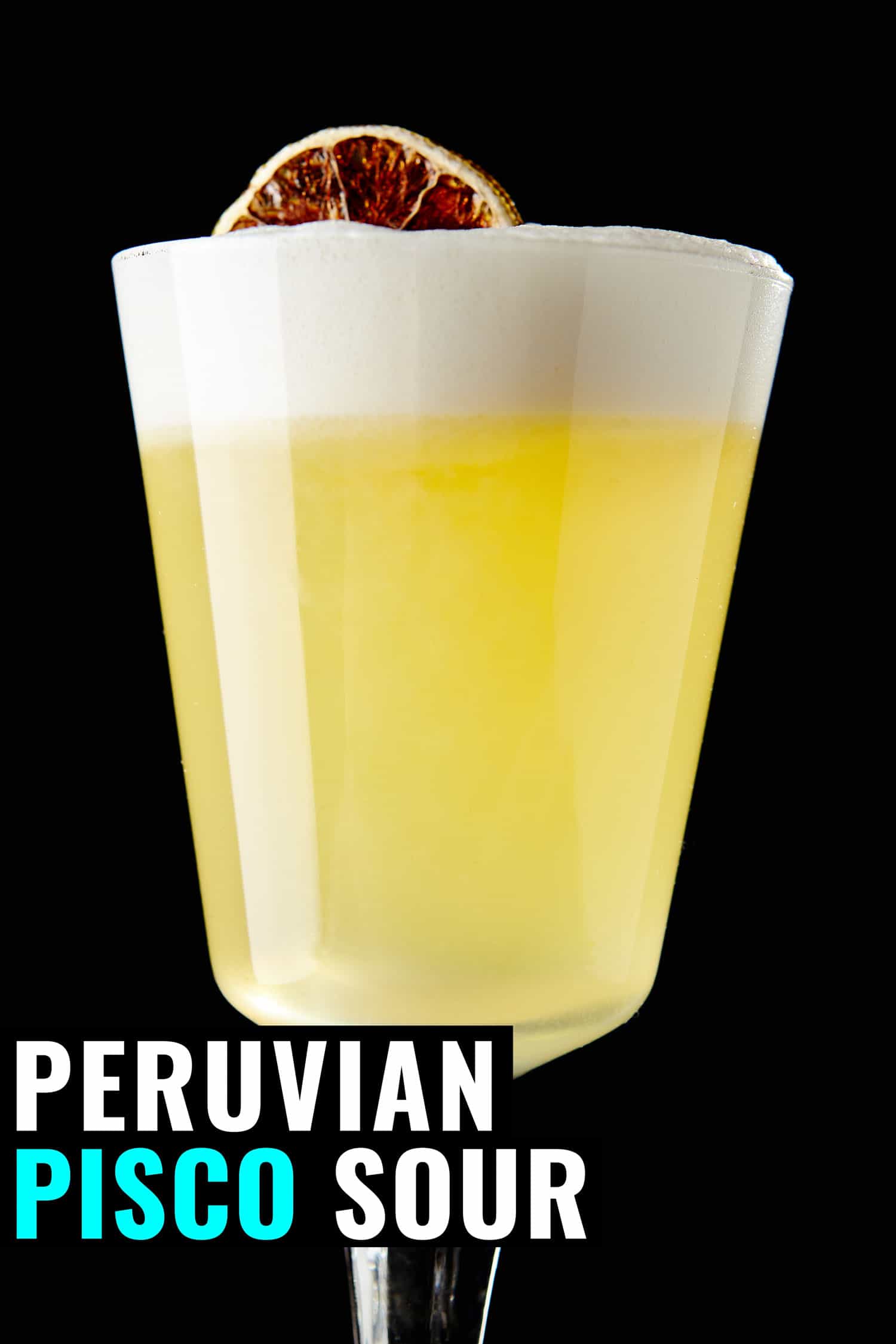 Peruvian pisco sour on a black background garnished with a blood orange.