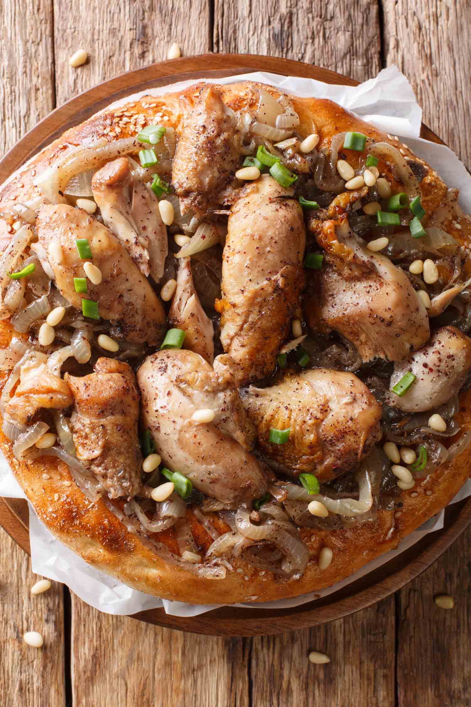 Jordanian food musakhan or sumac chicken closeup on a plate on the table. horizontal top view from above