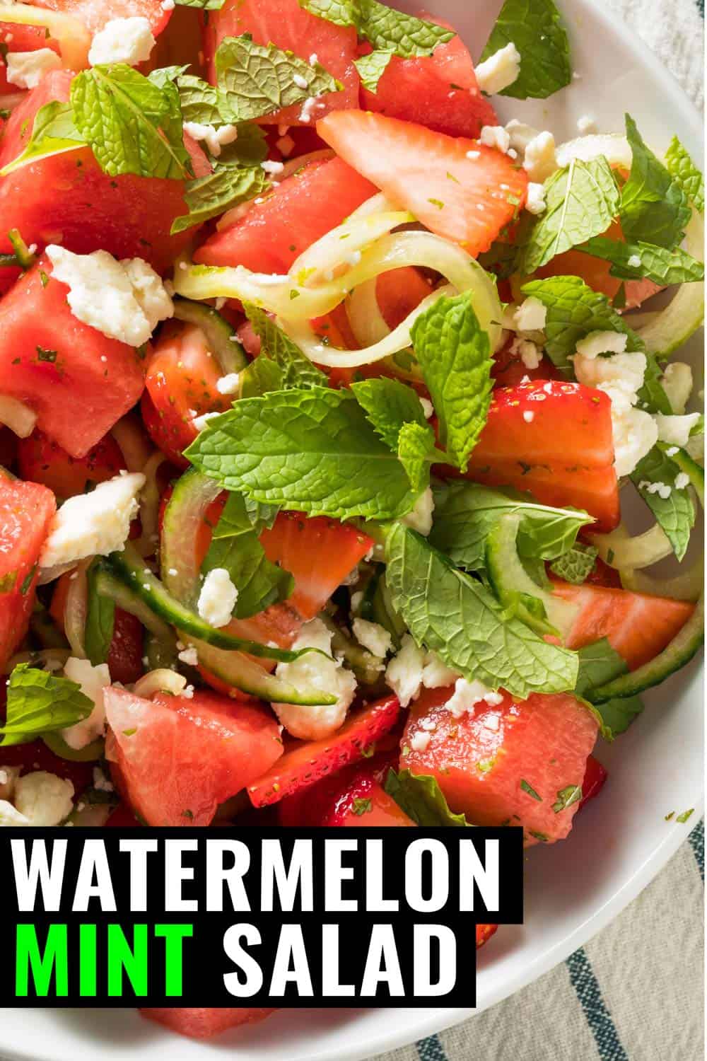 Watermelon feta mint salad in a bowl on a tea towel.