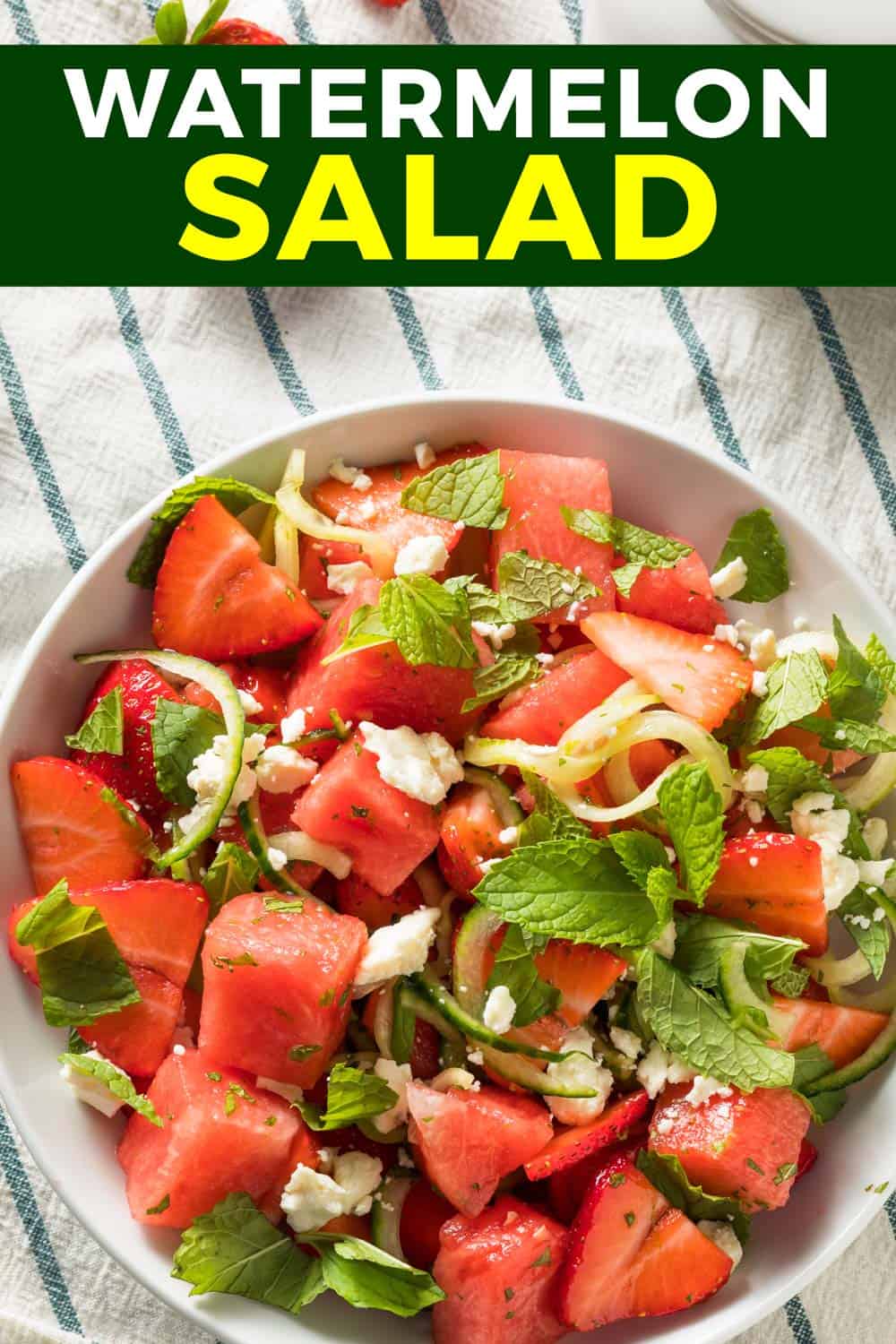 Watermelon feta mint salad in a bowl on a tea towel.