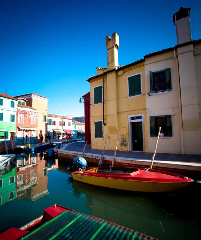 Burano Italy is a great day trip from Venice and features brightly coloured buildings perfect for photographers. No two buildings are the same colour on Burano.