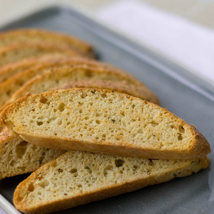 Savory biscotti on a blue plate.