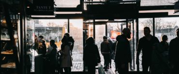 helsinki market with people by the entrance in a silhouette