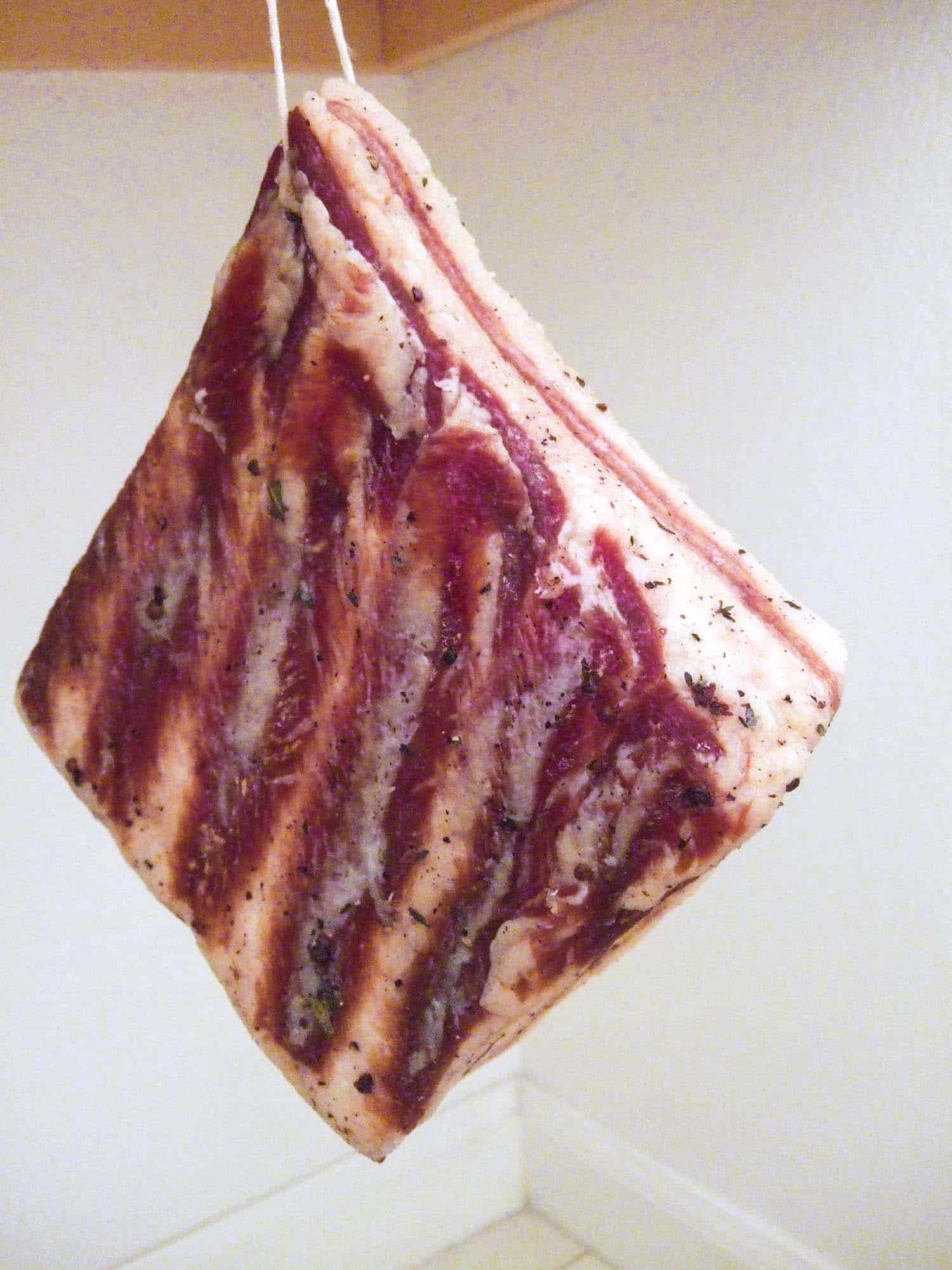 Pancetta hanging while curing, a final step in making pancetta