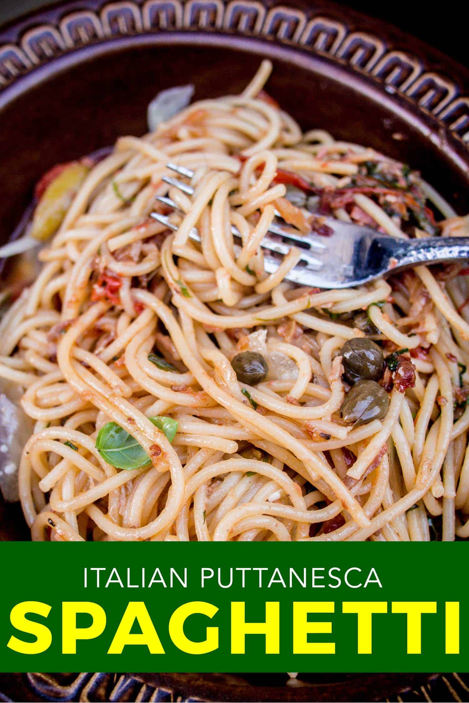 Italian spaghetti puttanesca pasta in a bowl.