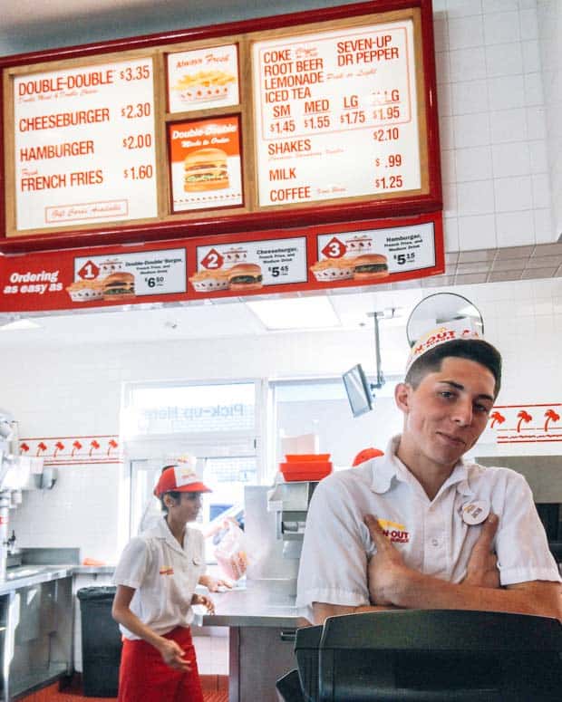 Happy employee at In-N-Out Burger. There are 29 In-N-Out Burger Secret Menu items. Have a look at the complete list at the best burger joint in the United States.