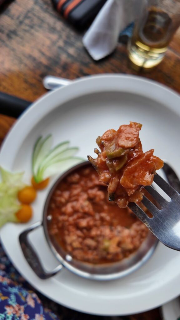 Apporeado de pescado in Cienfuegos Cuba, a stewed shredded fish in a metal bowl cooked in a tomato sauce