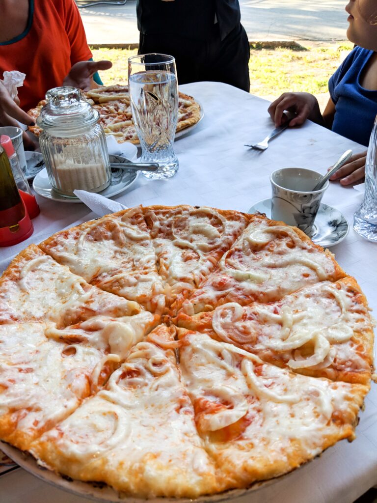 pizza with cheese and onion at a restaurant in Vinales Cuba