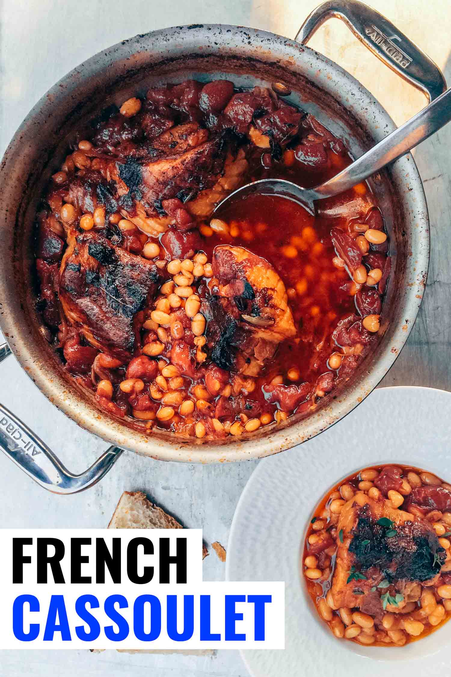 Classic French cassoulet with pork belly and navy beans in a pot on a table