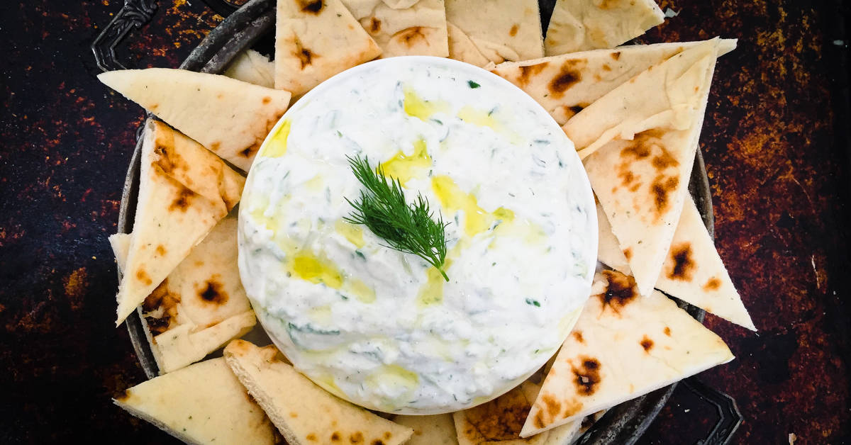 This healthy greek tzatziki recipe using greek yogurt is so easy to make you'll wonder why you ever bought it premade.