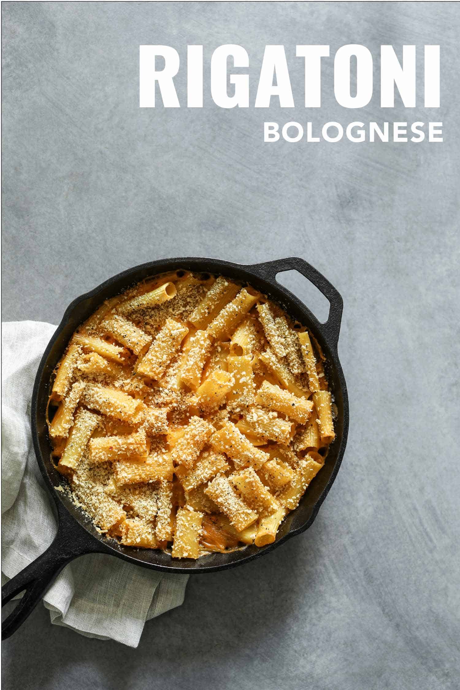 Rigatoni bolognese in a cast iron pan.