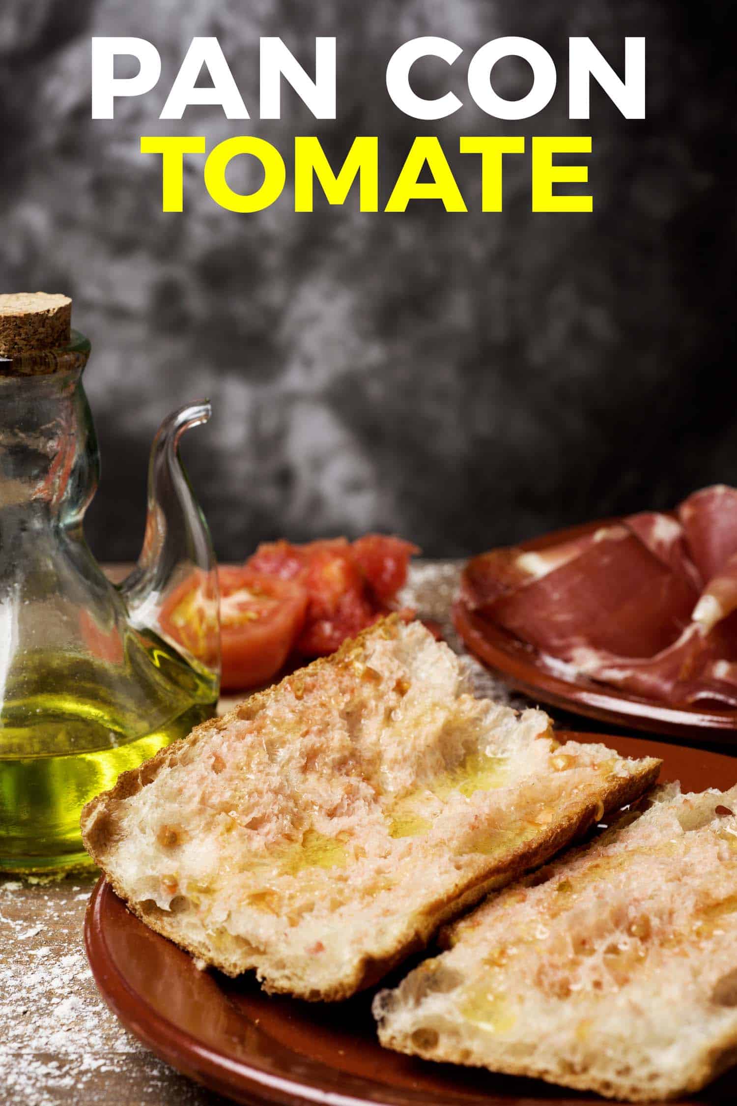 tomato bread on table with olive oil and tomatoes
