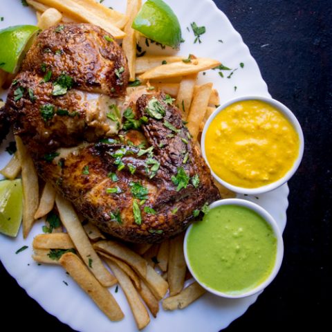 Peruvian rotisserie chicken with yellow and green aji sauces