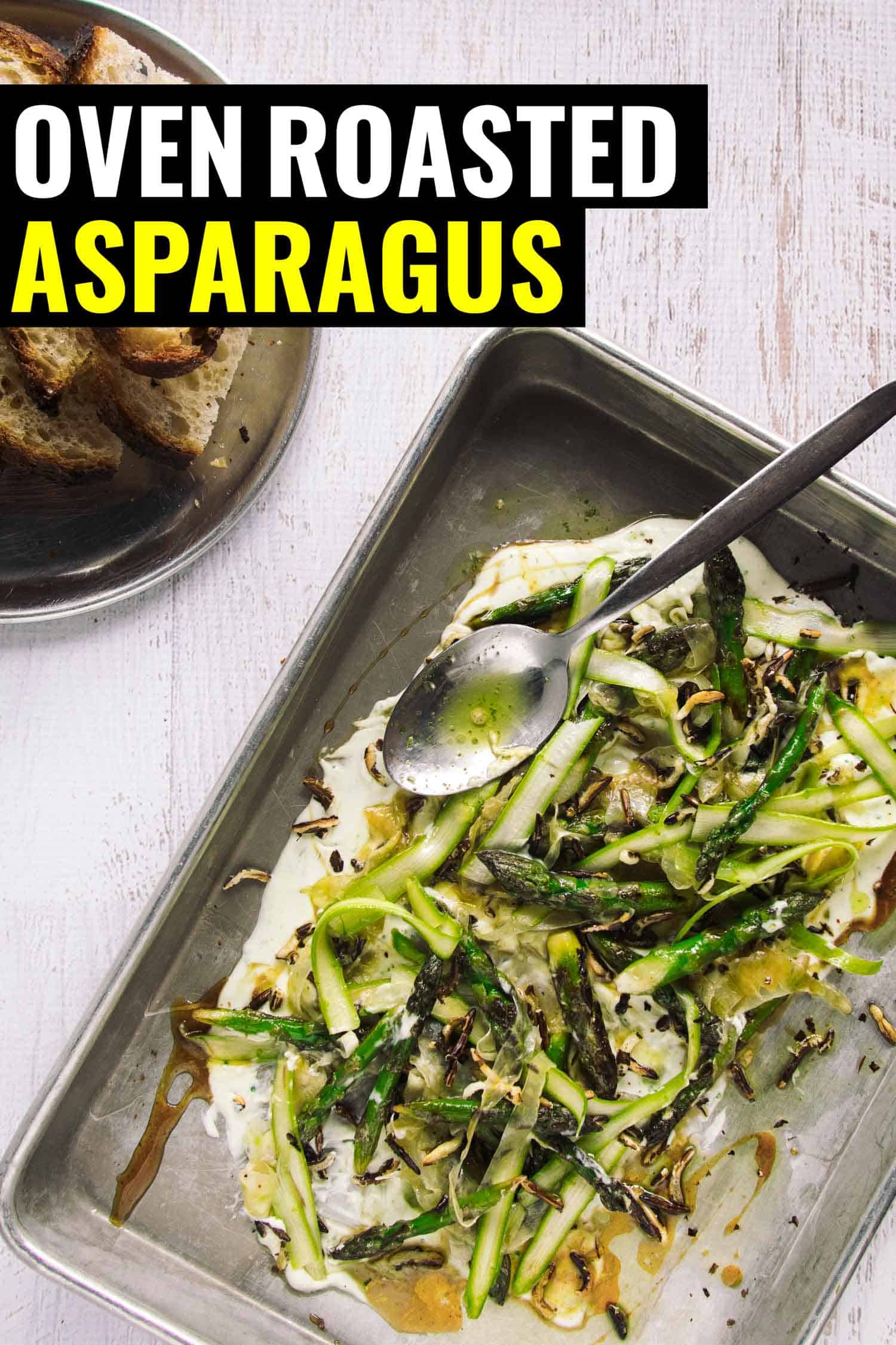 roasted asparagus in a pan with whipped ricotta