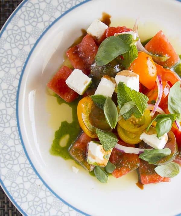This heirloom tomato and watermelon salad is the perfect taste of summer and so easy to make. This heirloom tomato and watermelon salad is the perfect taste of summer and so easy to make.