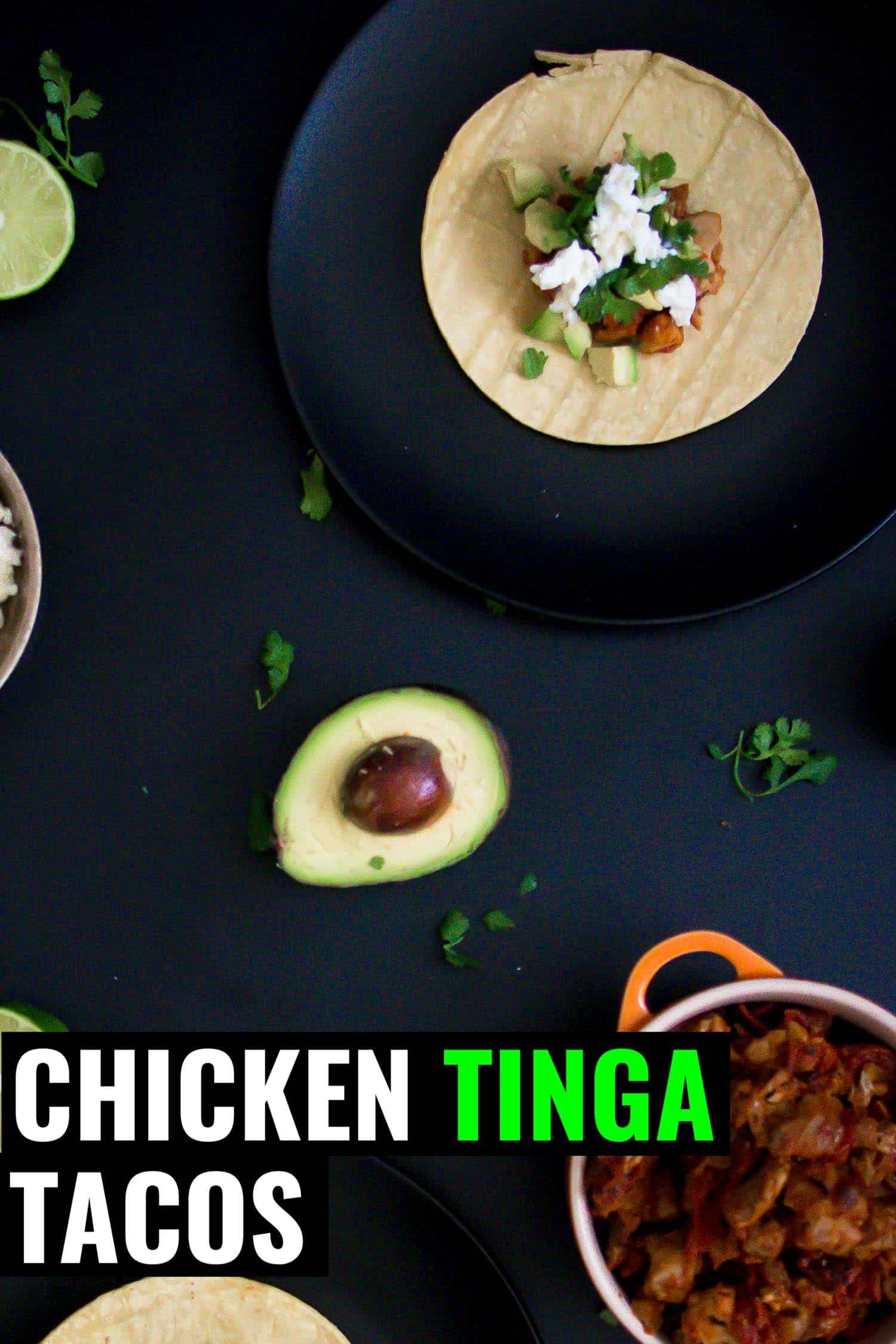 Mexican chicken tinga tacos on a black background