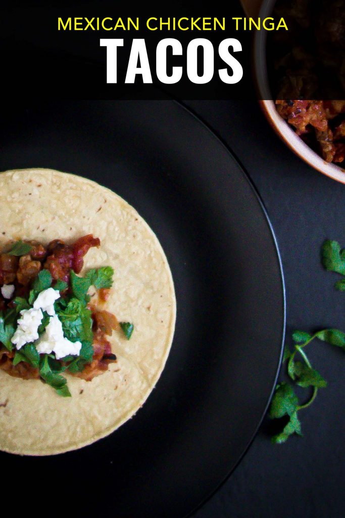 Mexican chicken tacos on a black background