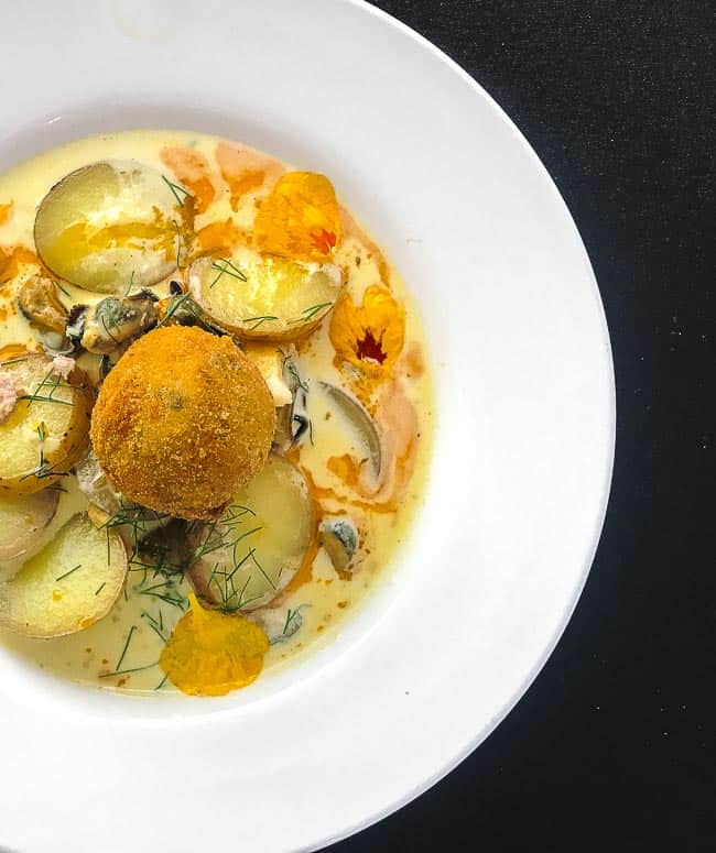 Classic PEI seafood chowder with a delicious Italian twist of sausage and lobster arancini.