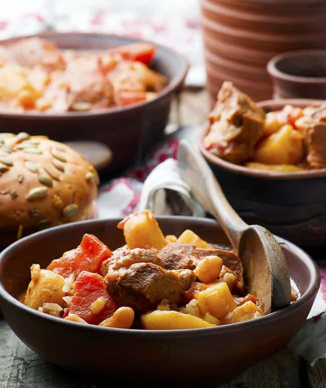 Bowl of cholent, a common food eaten during Hanukkah