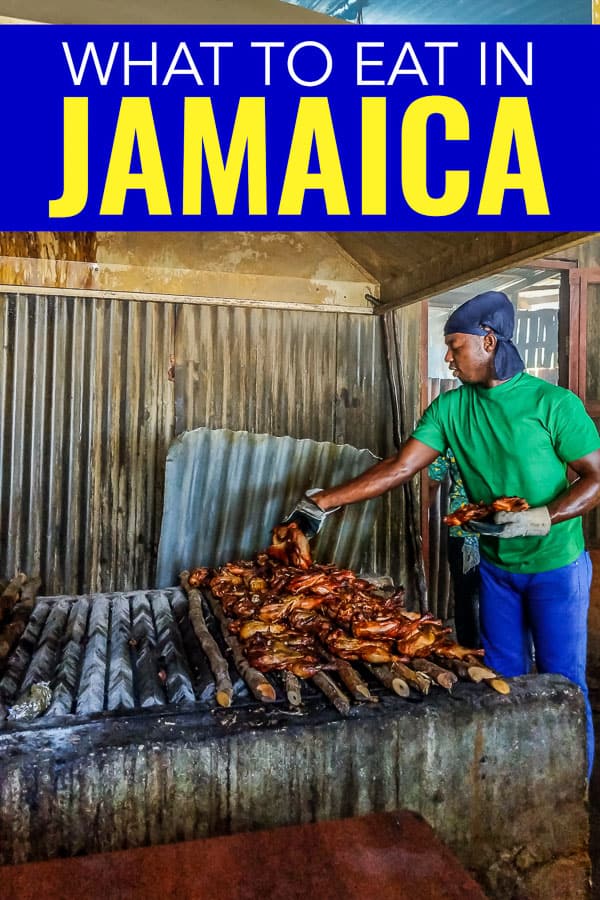 Jamaican jerk chicken being cooked over open coals