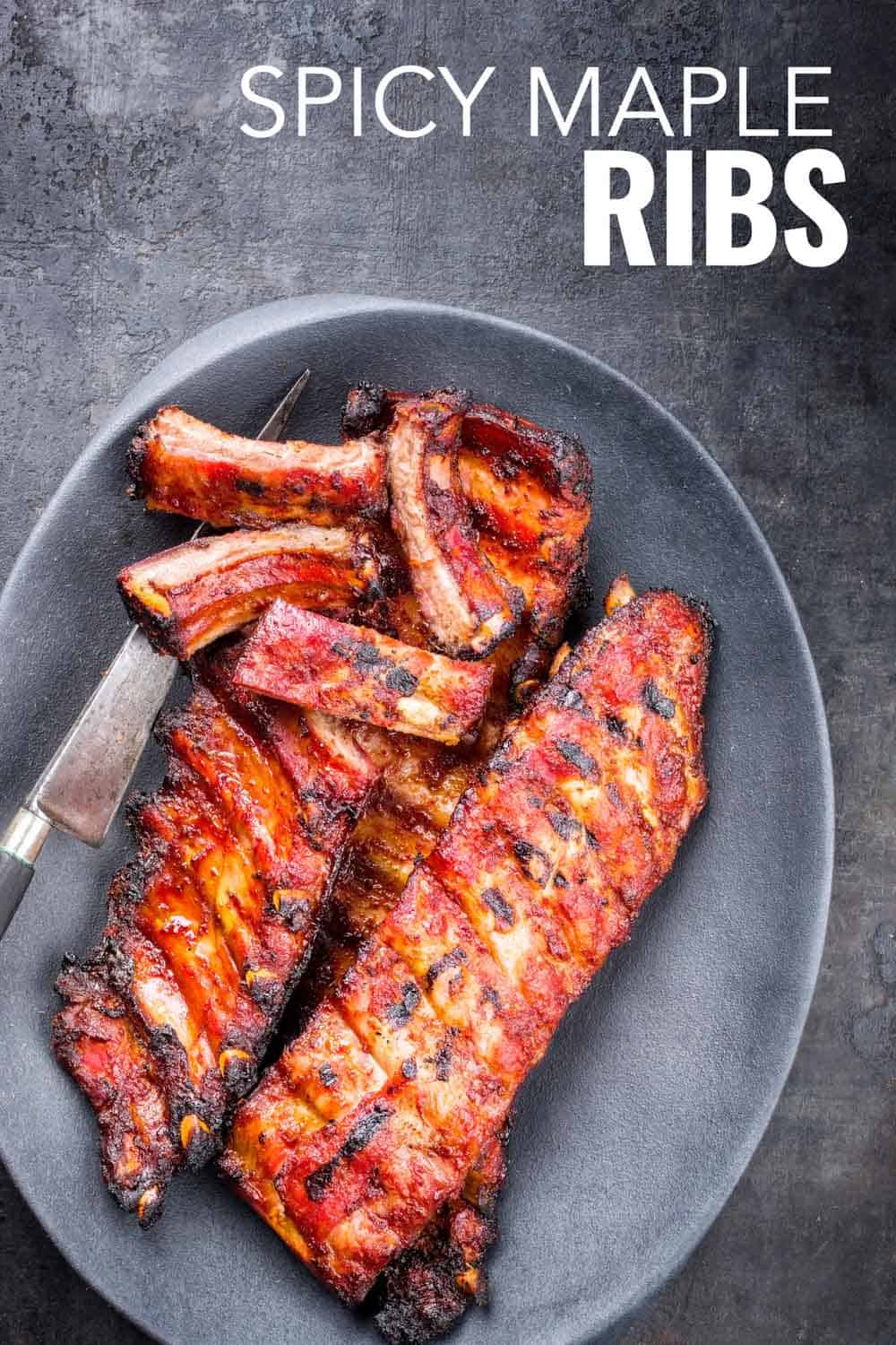Instant pot barbecue spare ribs St Louis cut with hot honey chili marinade as top view on a modern design cast iron pan