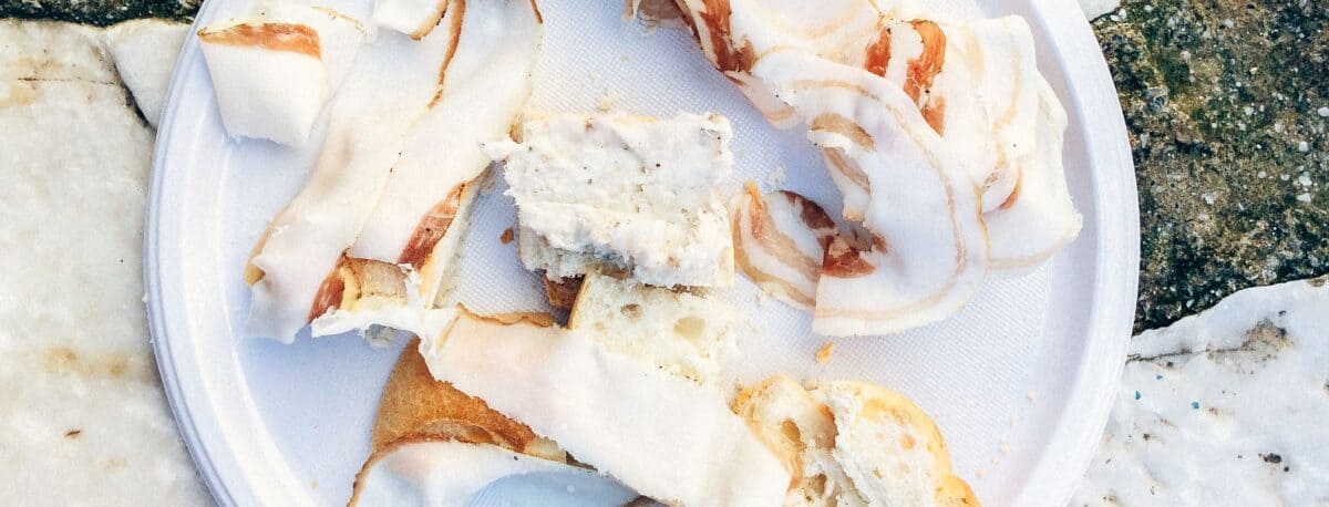 Sliced lardo on a plate in Colonnata Italy