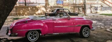 Pink convertible classic car on the street in Havana Cuba