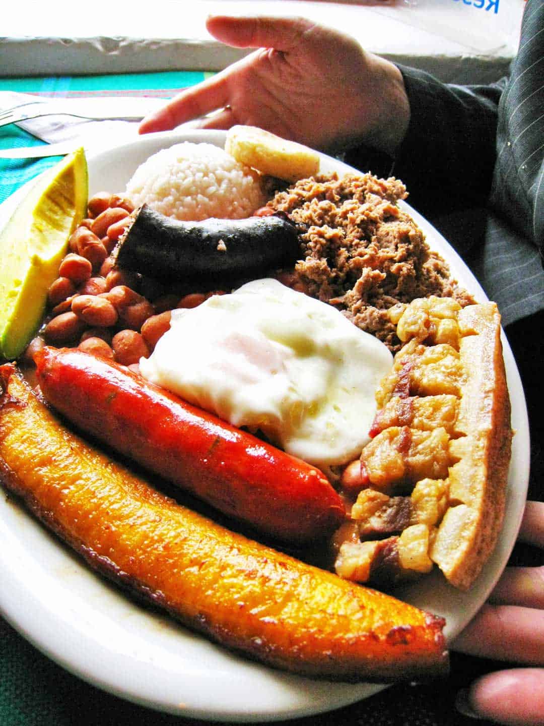 Bandeja Paisa is a Colombian food you should eat, so popular it is considered Colombia's national dish.