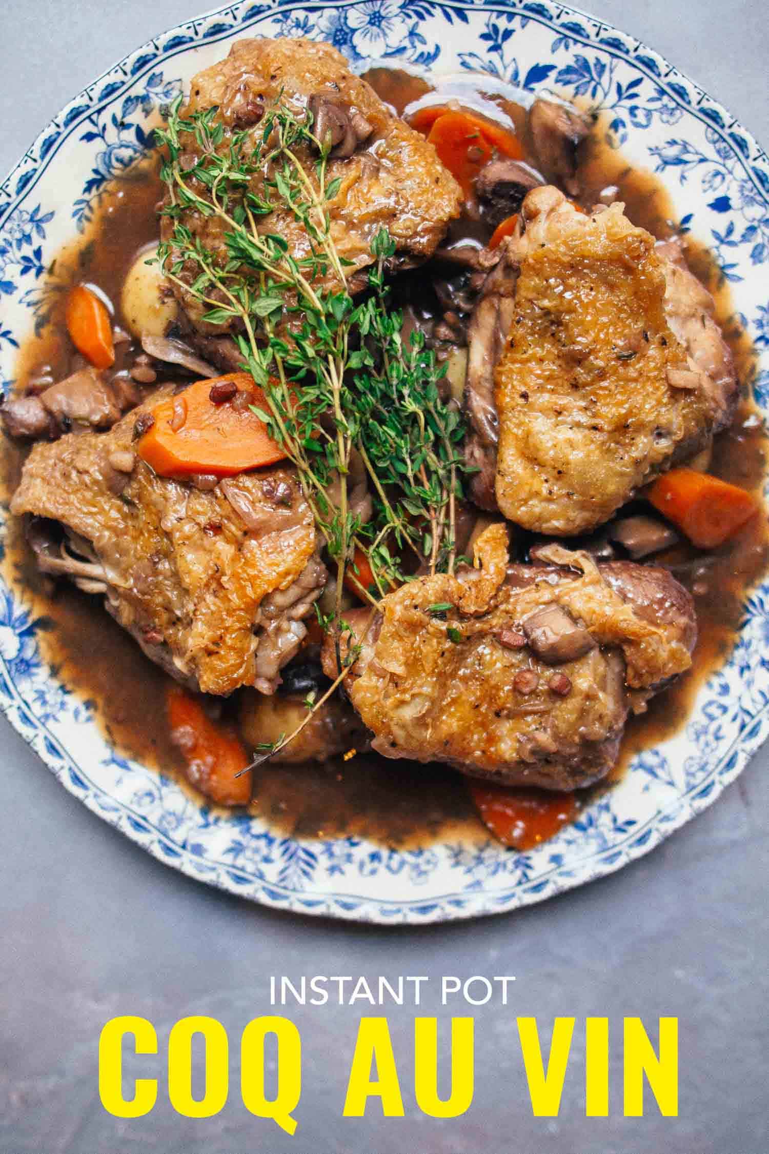 Family size plate of chicken thighs on a blue and white plate on a grey background