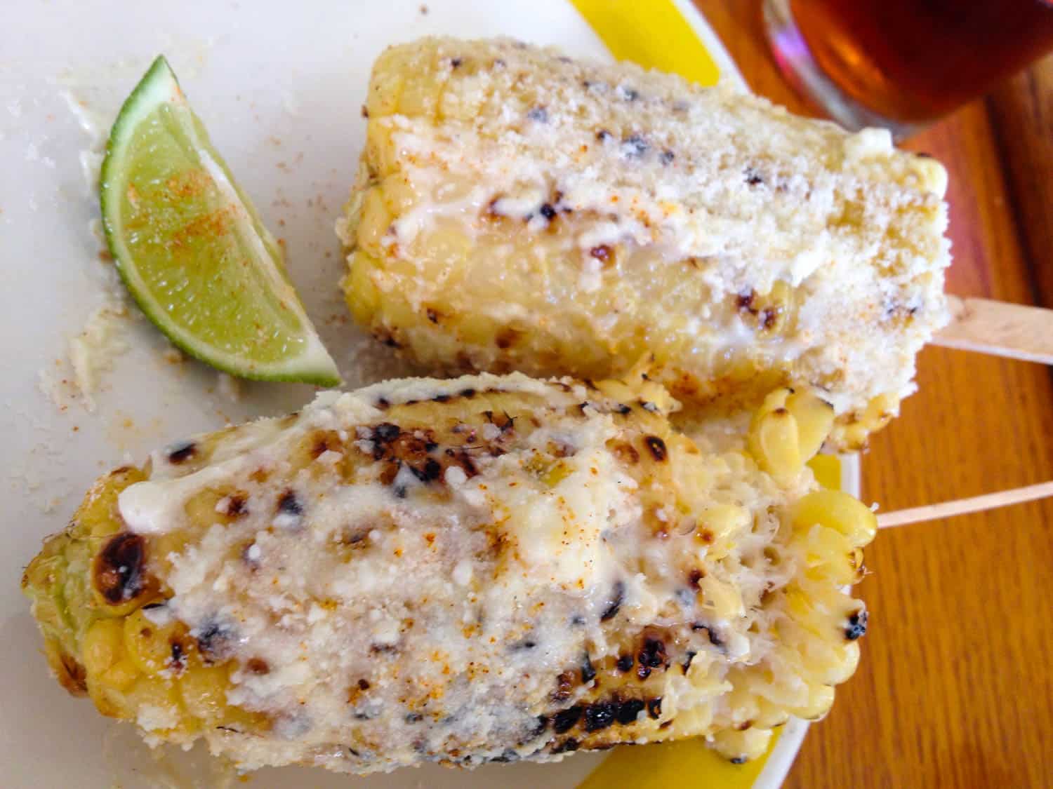 Elotes loco or grilled corn is a Guatemalan food you need to try. Discover 30 Guatemalan foods and travel to eat.