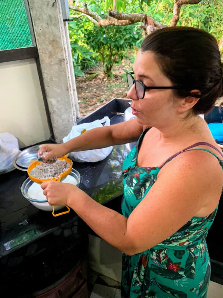 Learning to make Costa Rican rice and beans with fresh coconut.