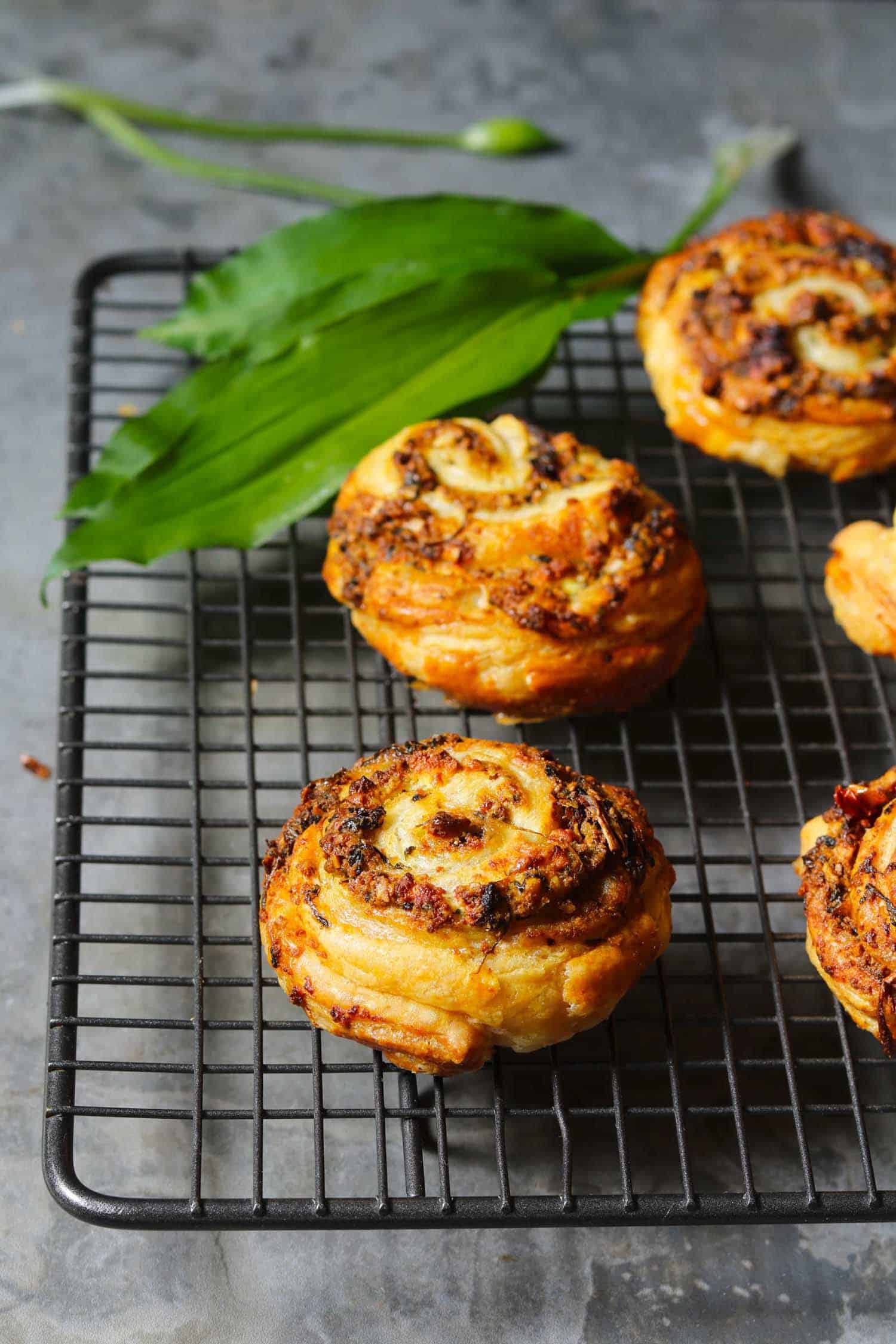 Sundried Tomato Swirls with Wild Garlic Pesto on a baking sheet