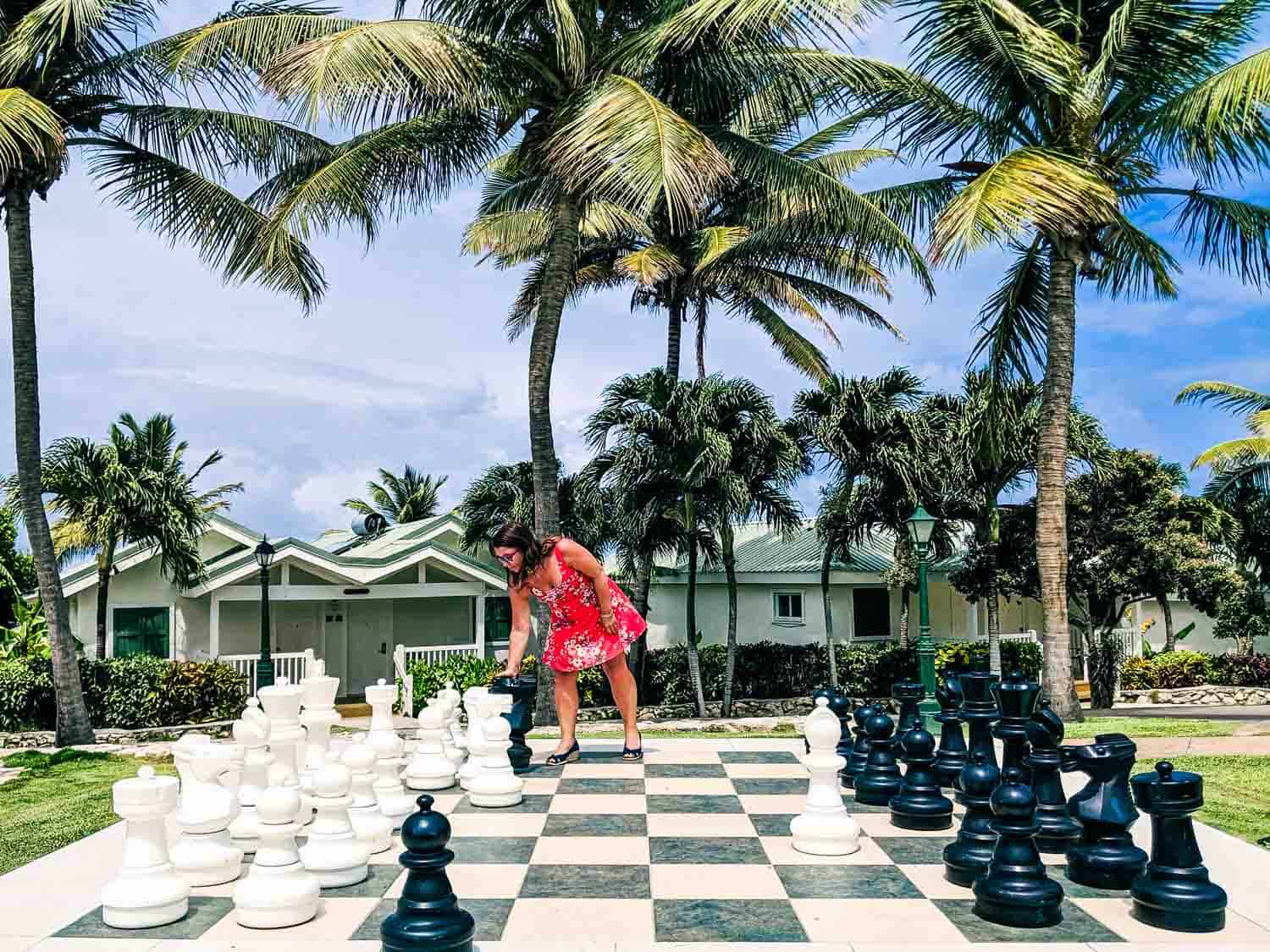 Ayngelina playing chess on human sized chess board