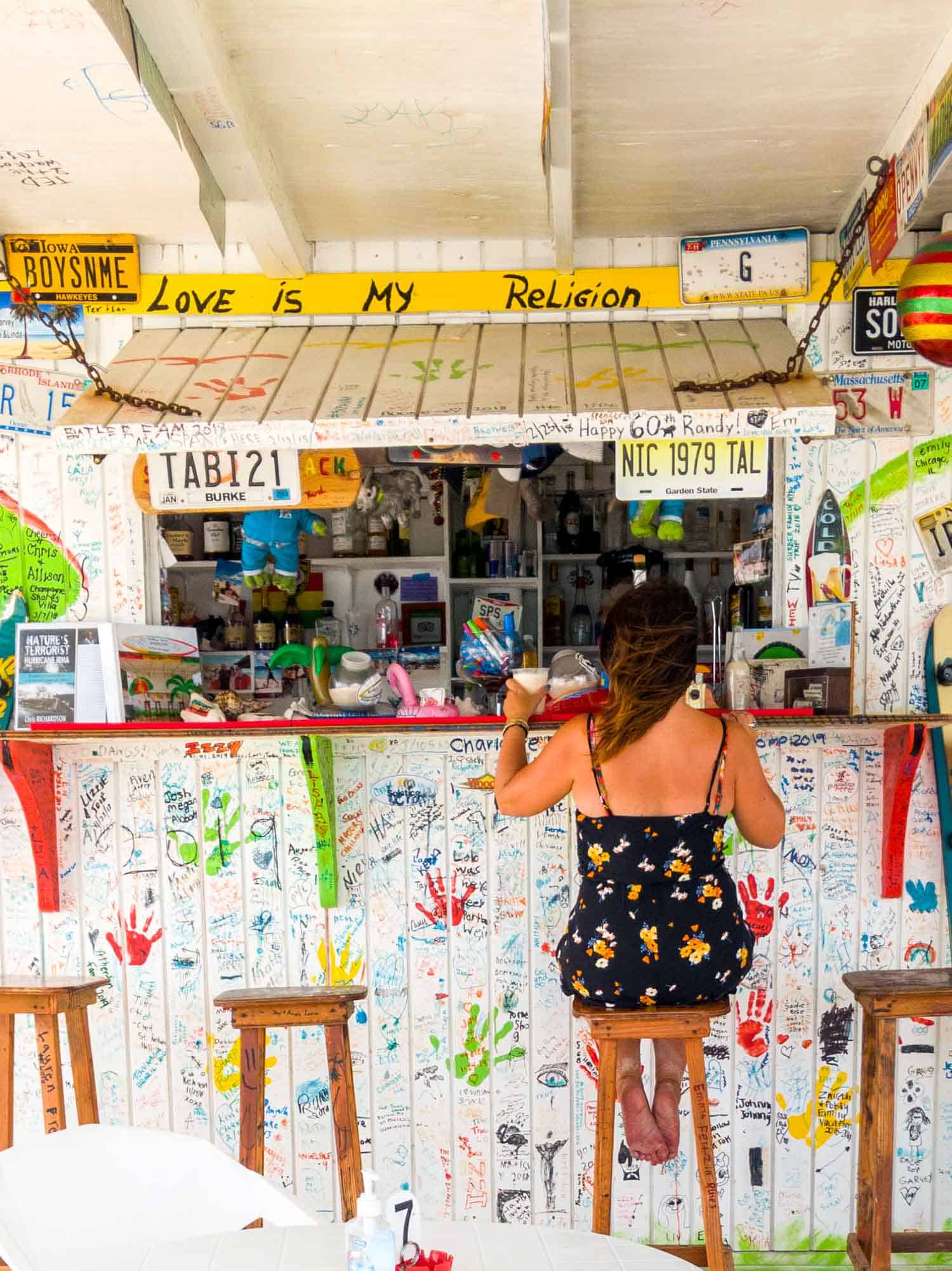 Ayngelina sitting at beach bar on Anguilla island