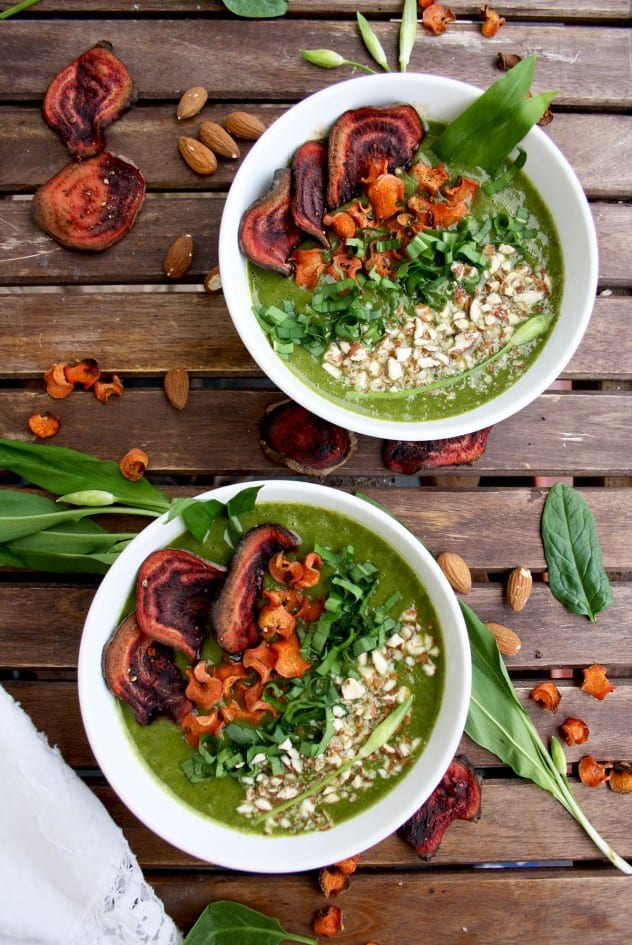 Two bowls of a wild garlic soup a popular ramps recipe, on a wooden backgrouns