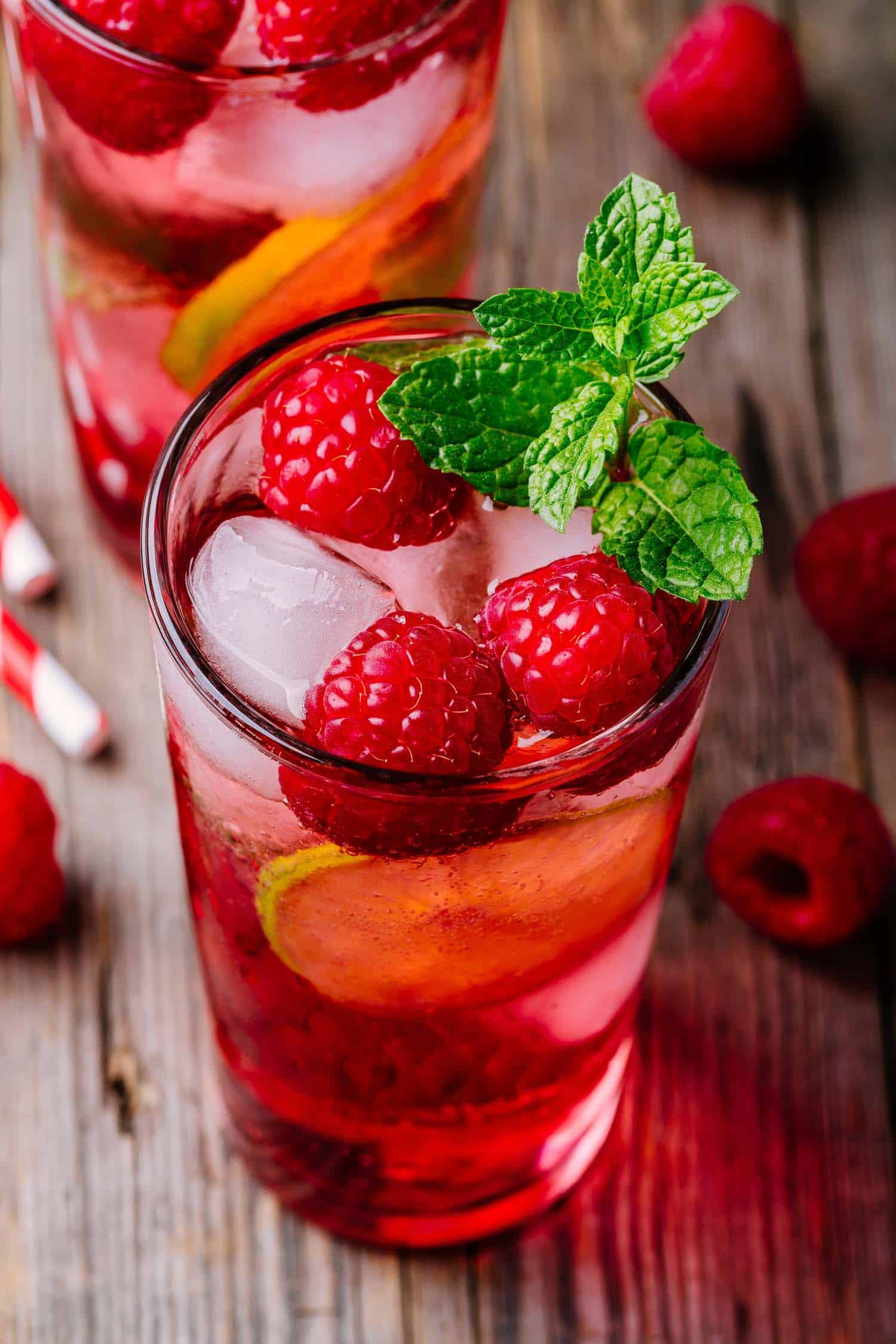 Rose sangria with ice in a glass with mint