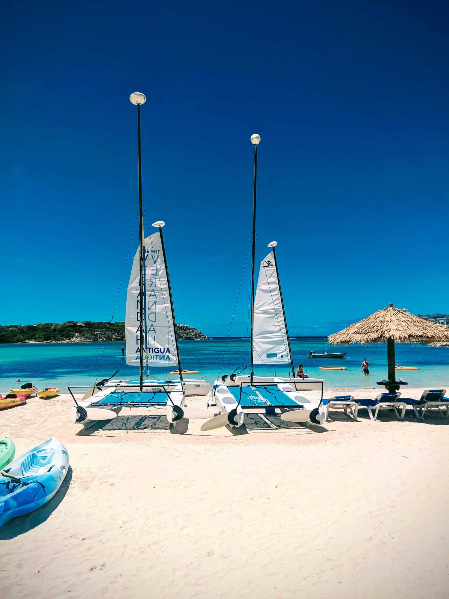 Verandah Bay resort beach on Antigua Island with mini catamarans