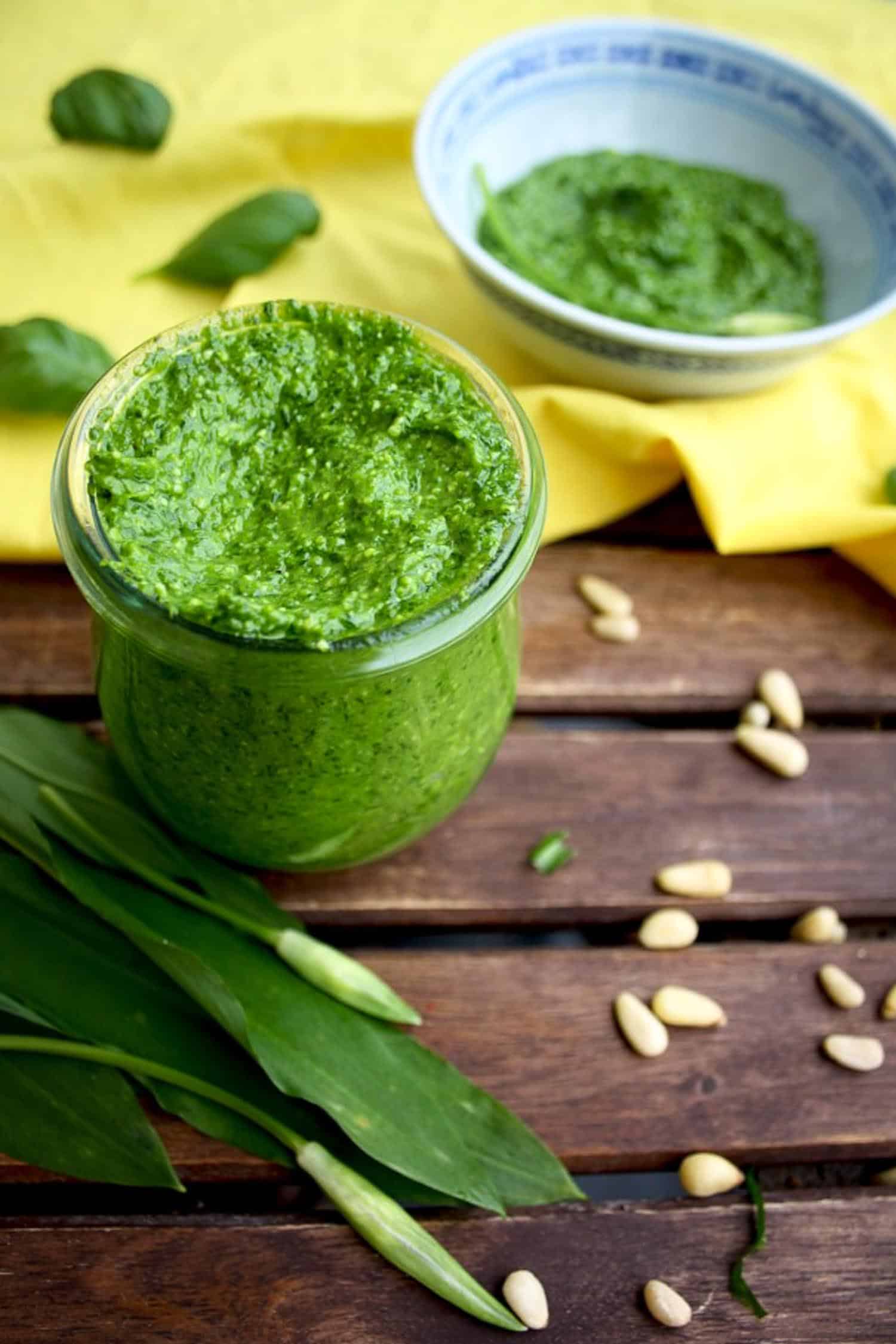 ramps recipe of pesto with pinenuts and ramps on wooden background