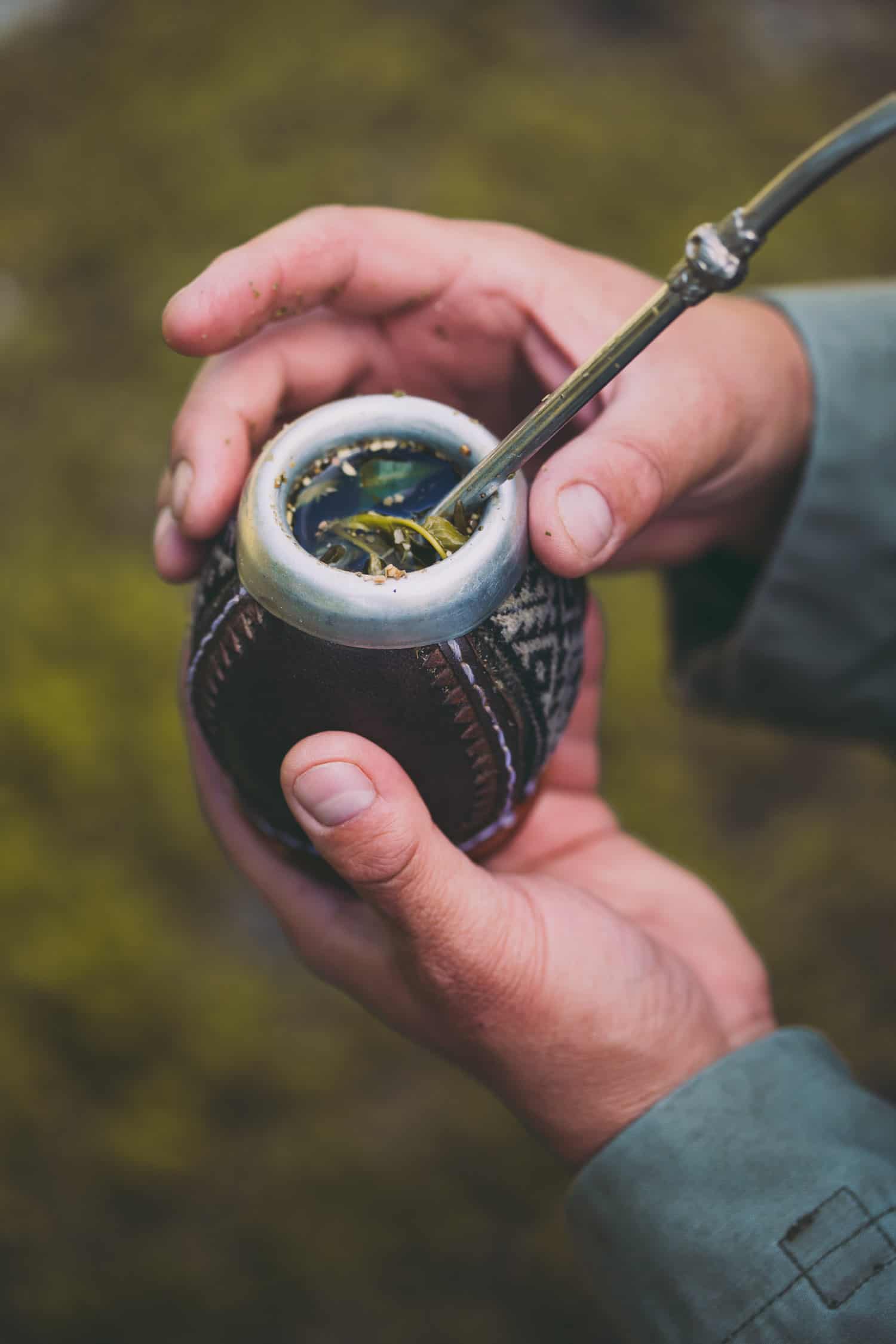 Man Holding Yerba Mate In Nature.