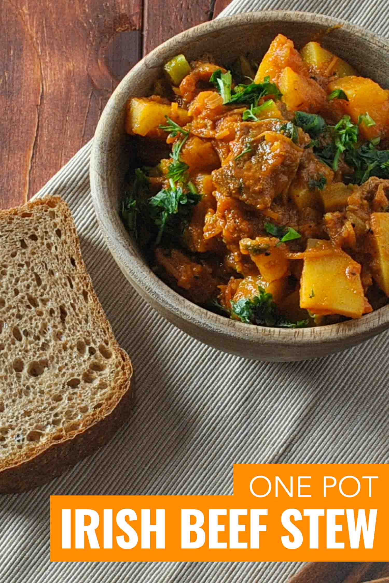 Irish beef stew in pottery on a wooden table