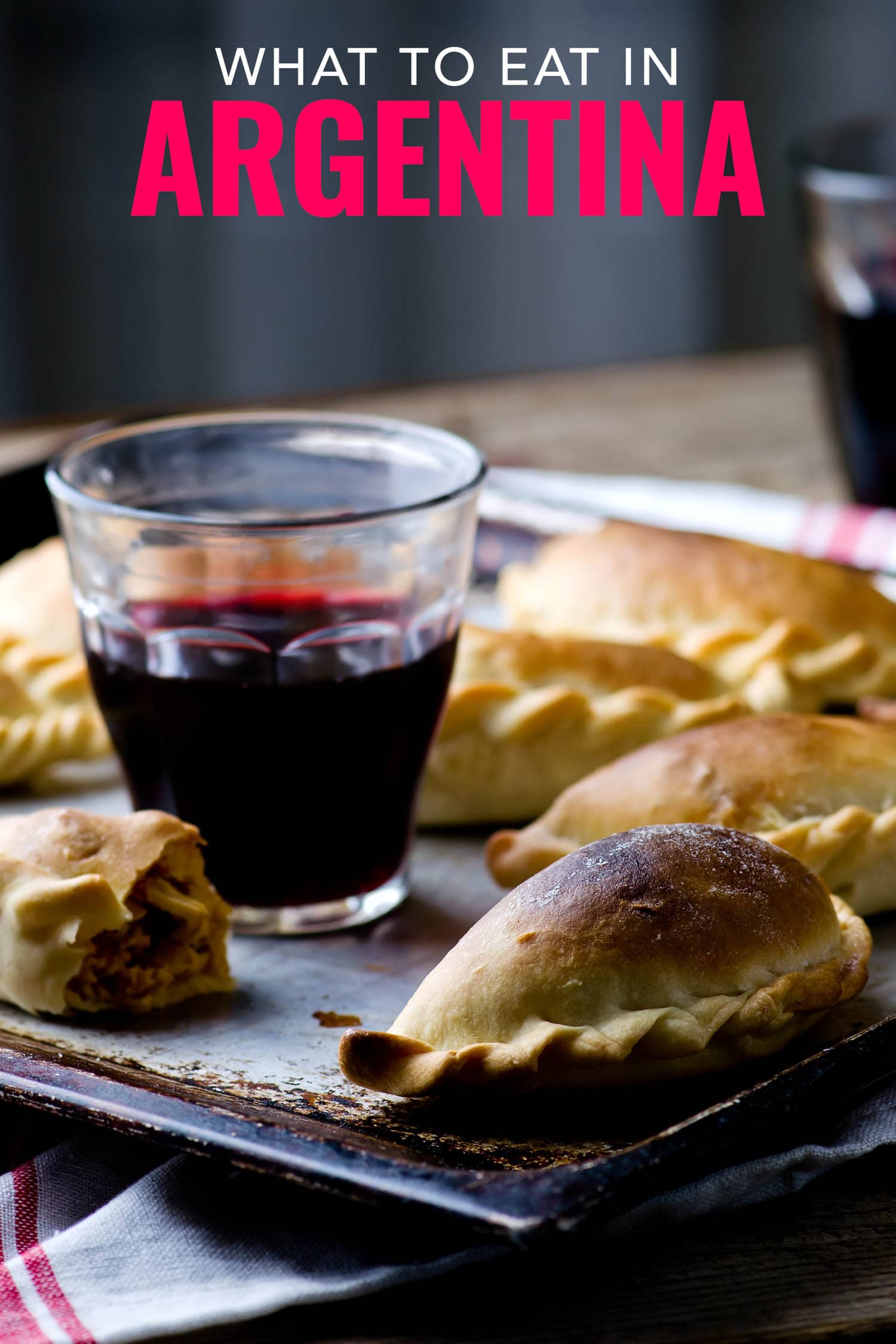 Argentinian food includes red wine and empanadas.