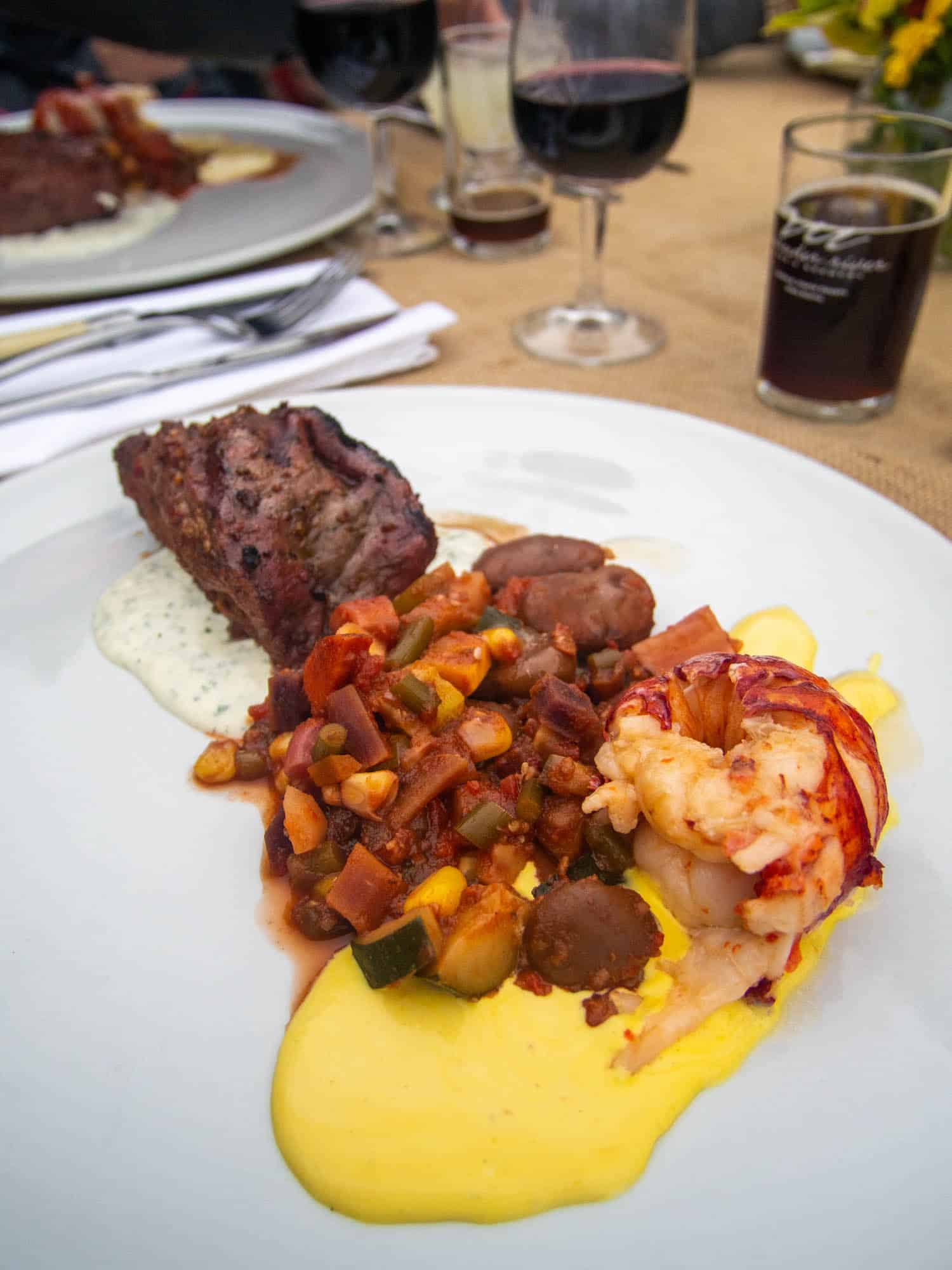 Local beef and Nova Scotia lobster tail at Dining on the ocean floor at Burntcoat Head in Nova Scotia Canada