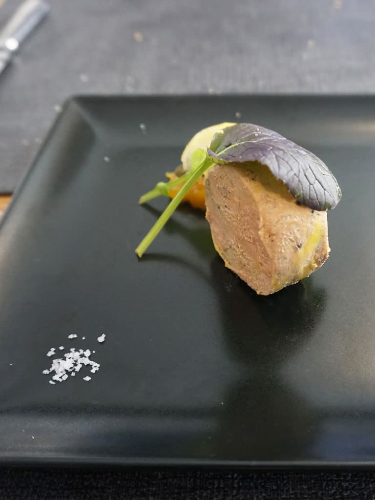 Foie gras on a black plate