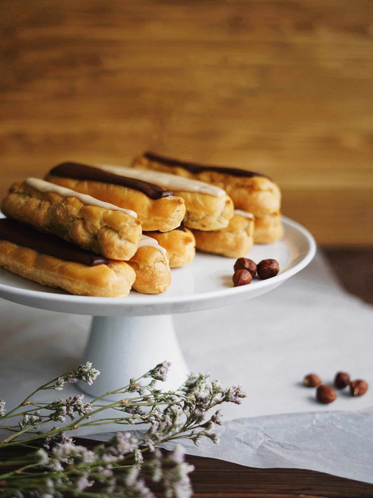 Classic French eclairs on a pastry stand.