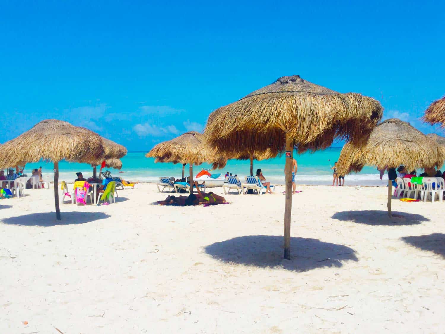 Palapa beach huts in Xpu-Ha Beach in the Mayan Riviera of Mexico