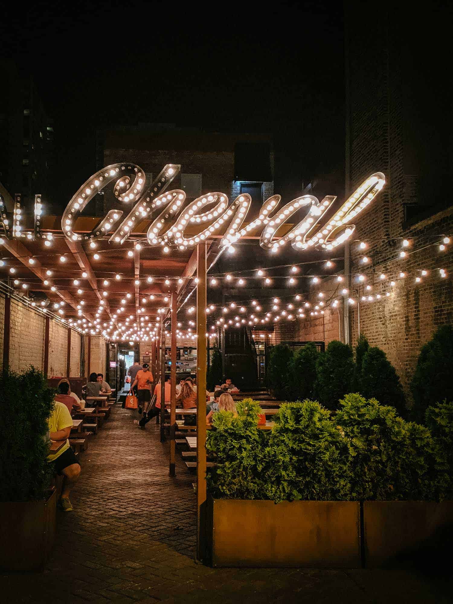 Cheval restaurant in Chicago, exterior dining space with sign.