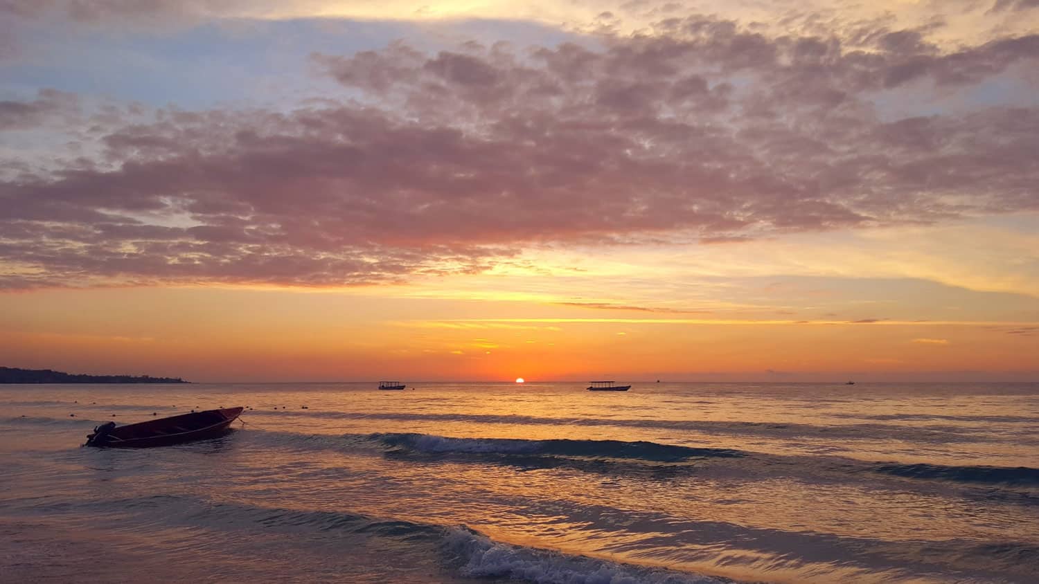 Seven Mile beach in Negril Jamaica at sunset.