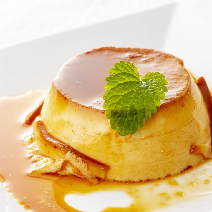 Cuban flan with mint on white plate